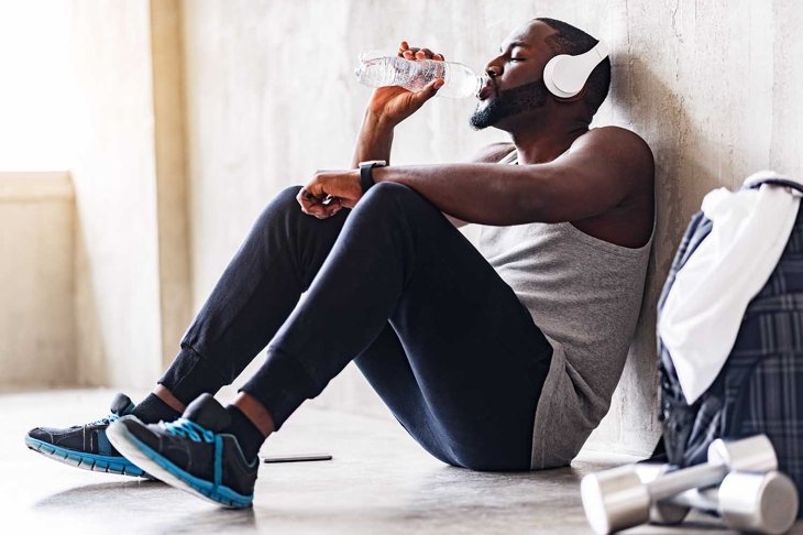 Exhausted handsome african sporty guy having leisure time